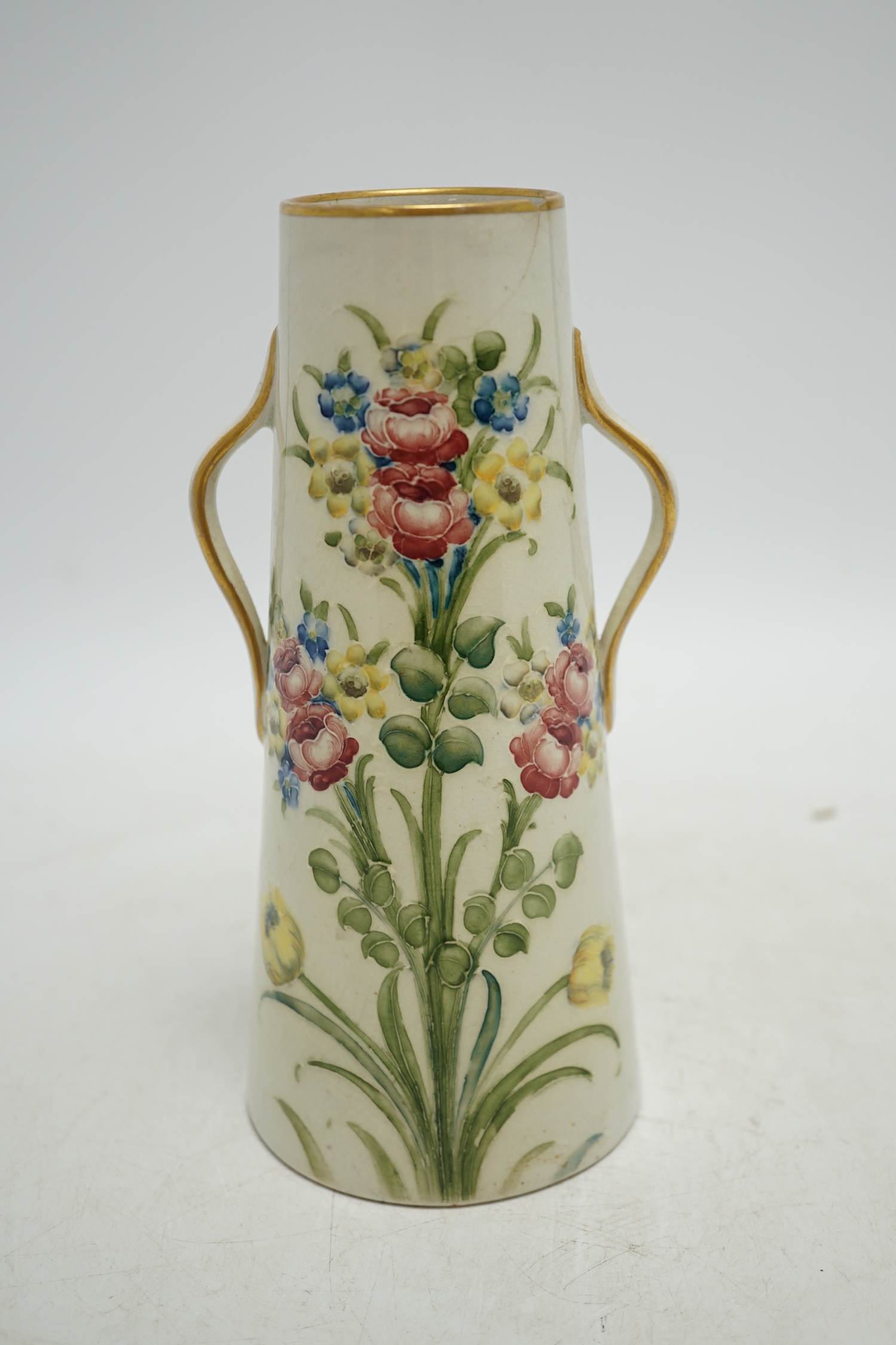 A Moorcroft for McIntyre Florian Ware two handled vase, circa 1905, height 20cm. Condition - large chip and crack to top rim